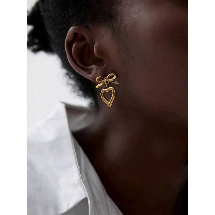Gold plated bow tie heart drop earrings