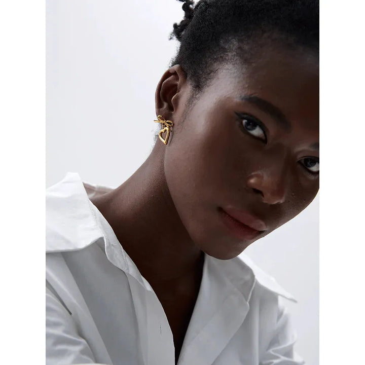 Gold plated bow tie heart drop earrings