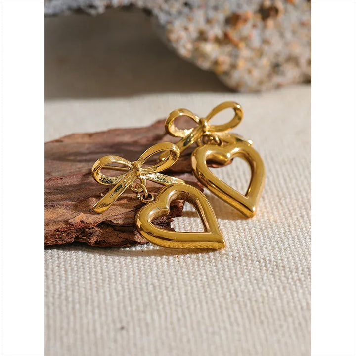 Gold plated bow tie heart drop earrings