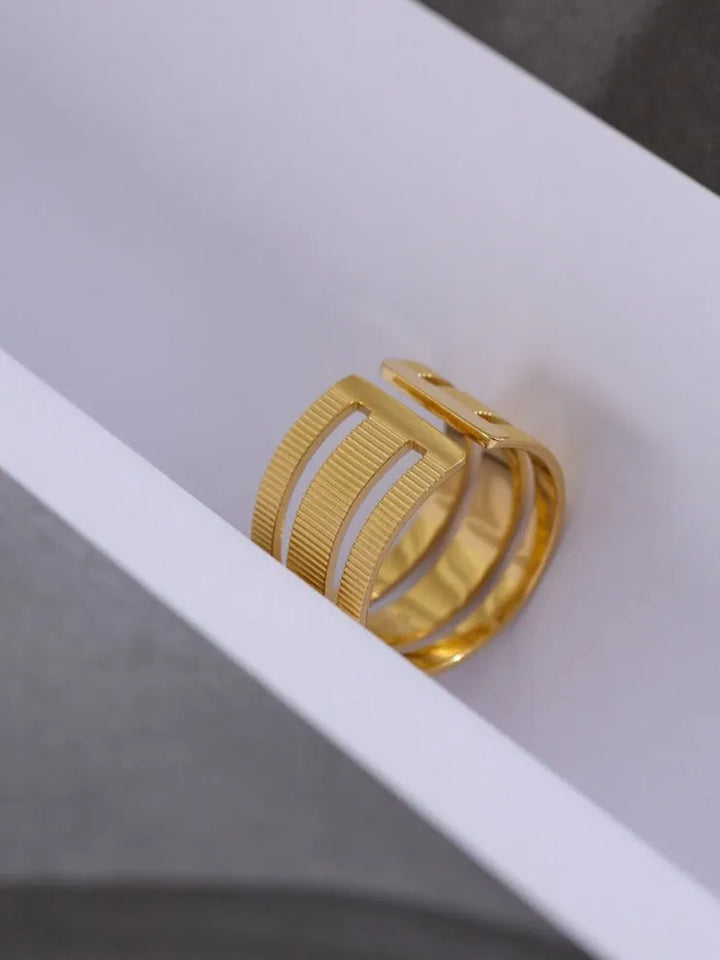 Gold plated textured open triple ring