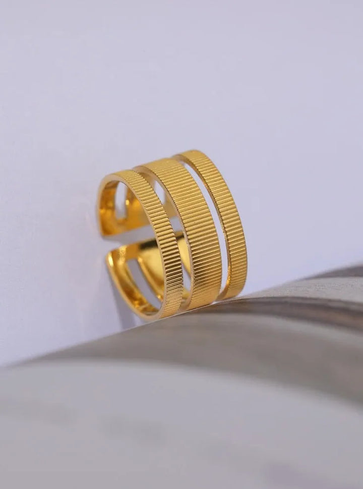 Gold plated textured open triple ring